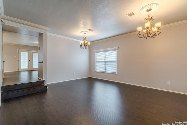 unfurnished room with crown molding, dark hardwood / wood-style flooring, and a notable chandelier