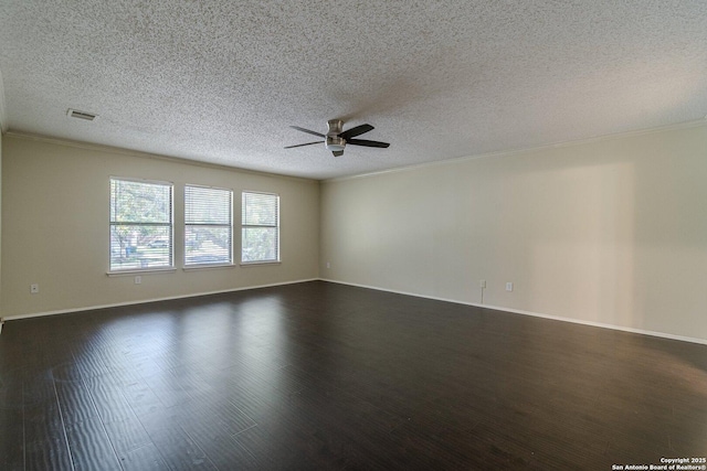 spare room with crown molding, dark wood-type flooring, a textured ceiling, and ceiling fan