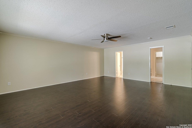 empty room featuring ornamental molding, dark wood-type flooring, a textured ceiling, and ceiling fan