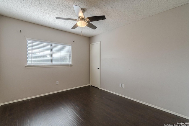 unfurnished room with ceiling fan, a textured ceiling, and dark hardwood / wood-style flooring