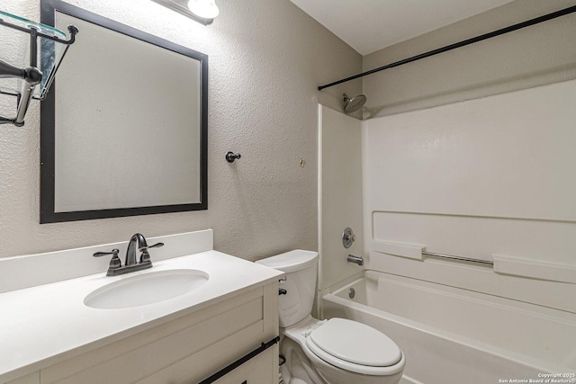 full bathroom featuring vanity, toilet, and shower / tub combination