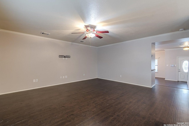 spare room featuring crown molding, ceiling fan, and dark hardwood / wood-style flooring