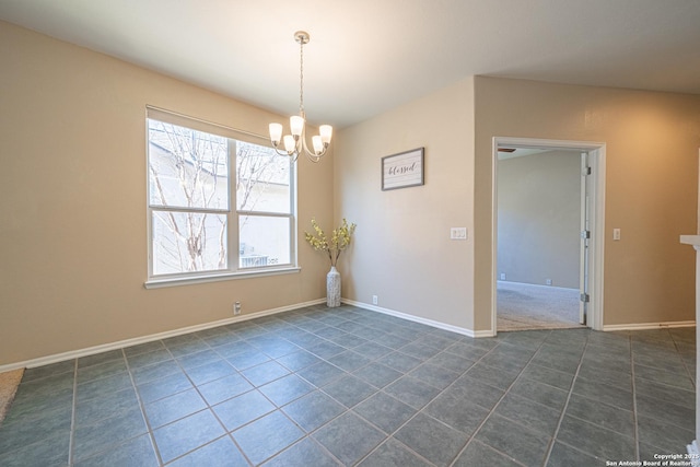 empty room featuring an inviting chandelier