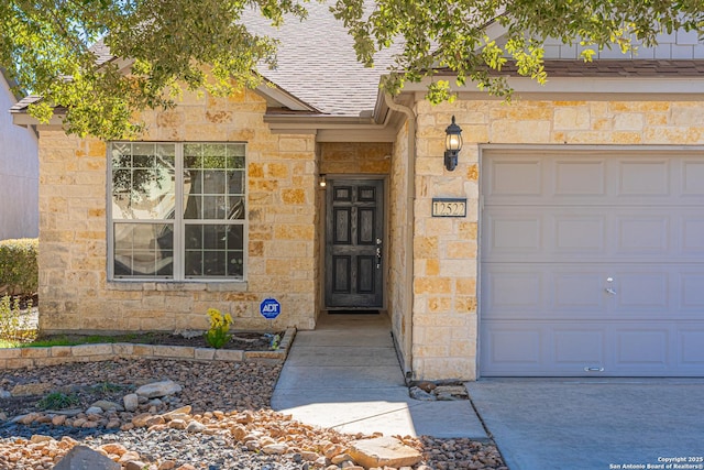 property entrance with a garage