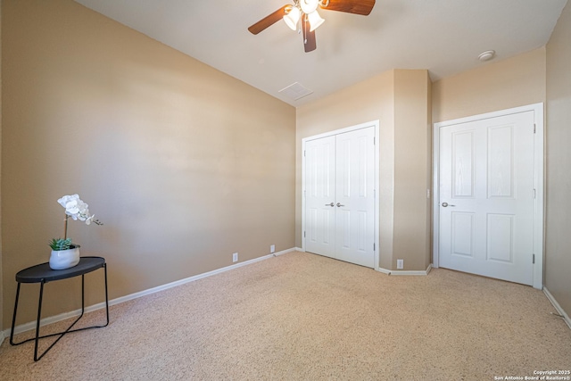 bedroom featuring ceiling fan, a closet, and light carpet