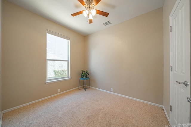 carpeted empty room with ceiling fan