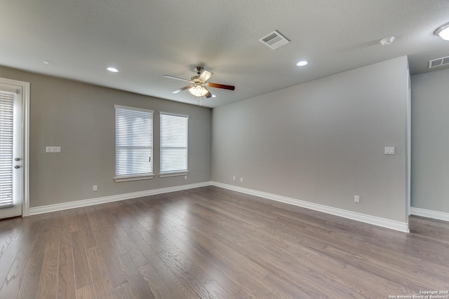 unfurnished room featuring ceiling fan and light hardwood / wood-style flooring