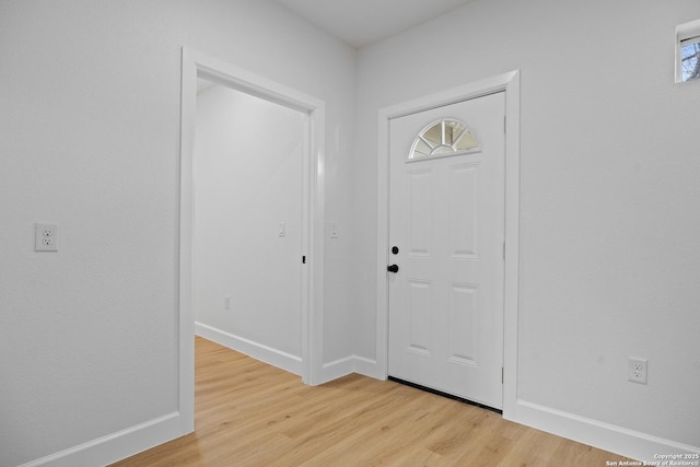 foyer entrance with light wood-type flooring