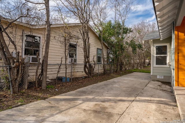 view of side of property featuring a patio area