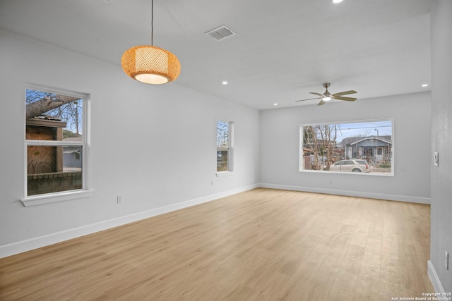 spare room with ceiling fan and light hardwood / wood-style floors