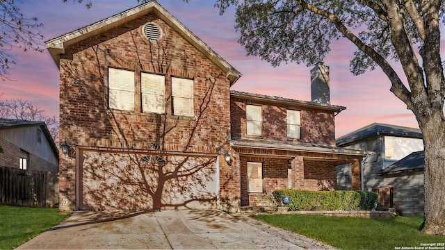 front of property with a garage and covered porch