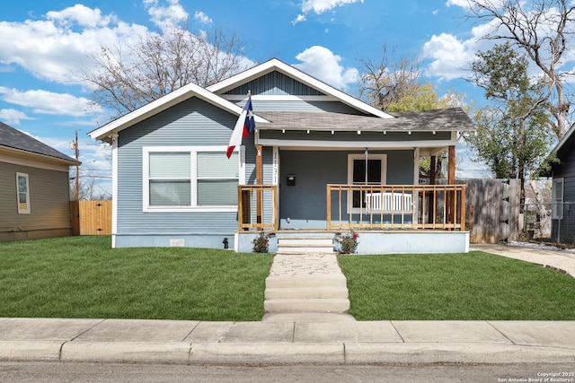 bungalow-style home with a porch and a front lawn