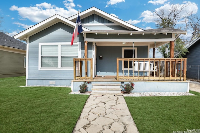 view of front of home featuring a porch and a front lawn