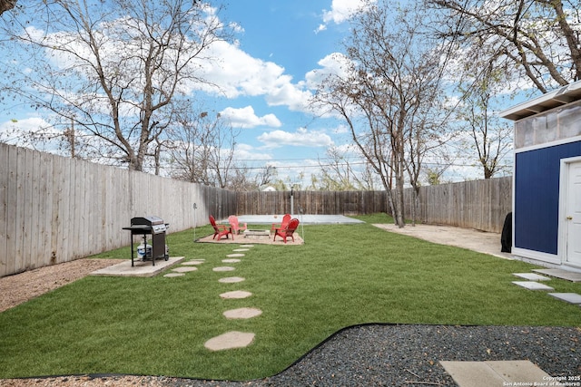 view of yard with a patio area and a fire pit