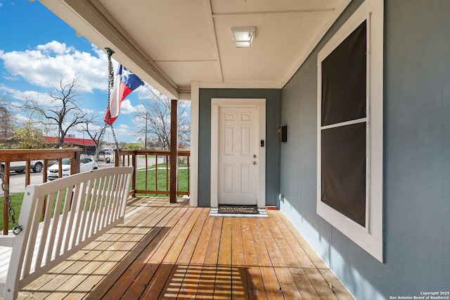 wooden deck featuring covered porch