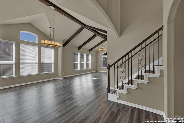 entrance foyer with dark hardwood / wood-style flooring and vaulted ceiling with beams