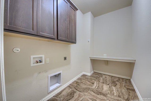 laundry room featuring cabinets, hookup for a washing machine, and electric dryer hookup