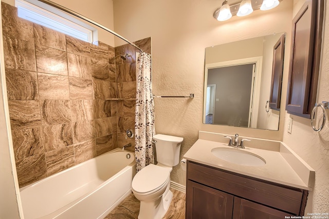 full bathroom featuring vanity, toilet, and shower / tub combo