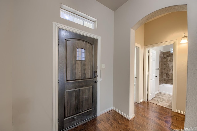 foyer entrance with dark hardwood / wood-style flooring