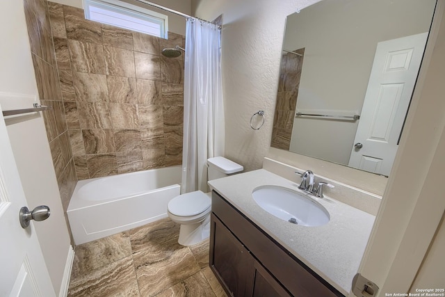 full bathroom with vanity, toilet, and shower / tub combo