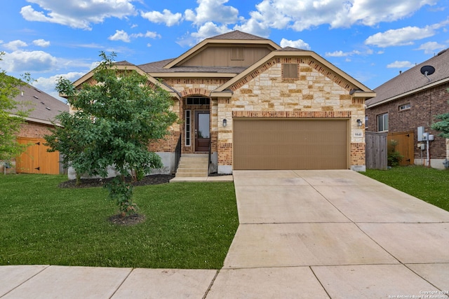 view of front of property with a garage and a front lawn