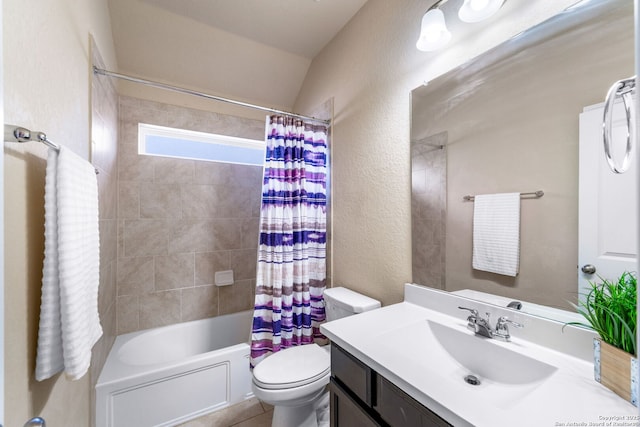 full bathroom with vanity, lofted ceiling, toilet, and shower / bath combo with shower curtain