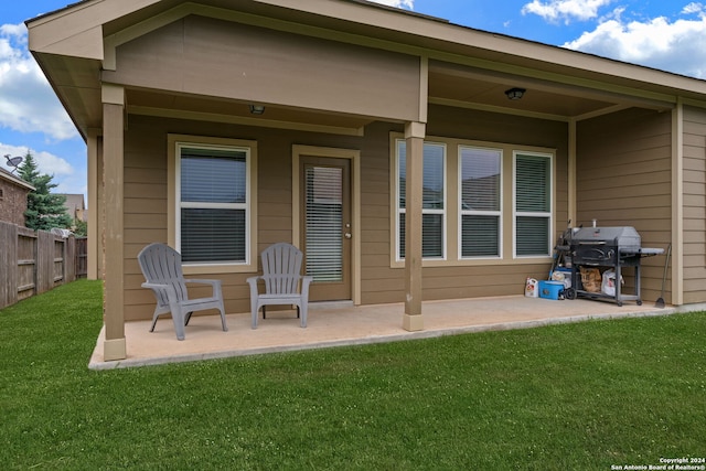 back of house featuring a yard and a patio area