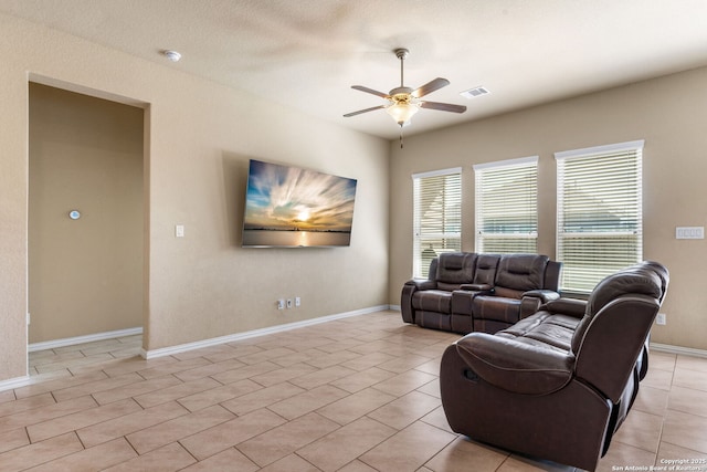 tiled living room with ceiling fan