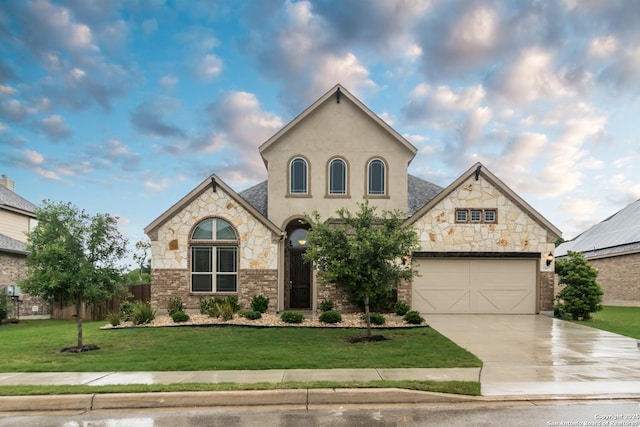 view of front of house featuring a garage and a front yard