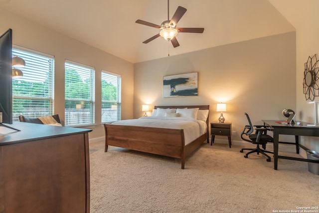 carpeted bedroom featuring lofted ceiling and ceiling fan