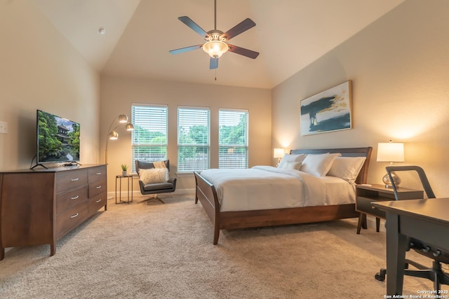 carpeted bedroom with vaulted ceiling and ceiling fan