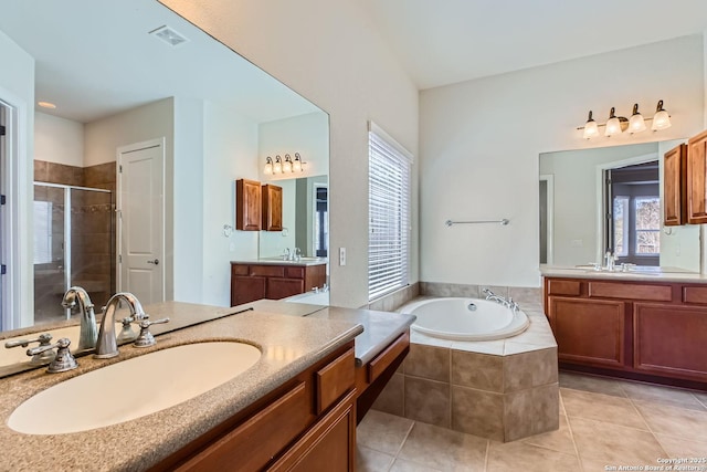 bathroom featuring plus walk in shower, tile patterned floors, and vanity