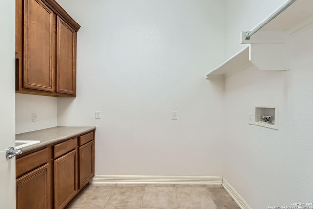 laundry area with cabinets and washer hookup