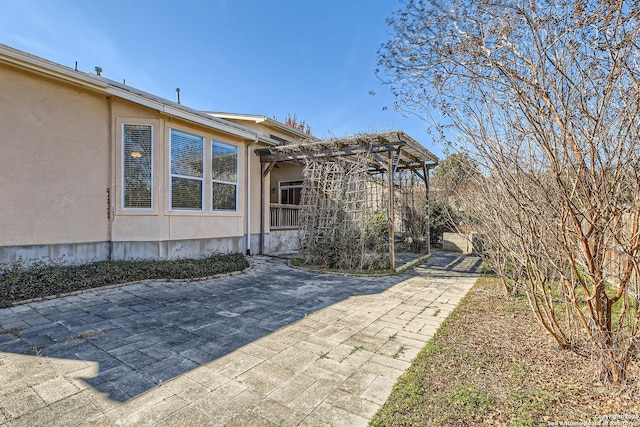 exterior space with a pergola and a patio area