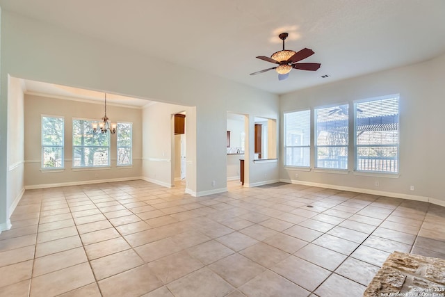 unfurnished living room with ceiling fan with notable chandelier and light tile patterned floors