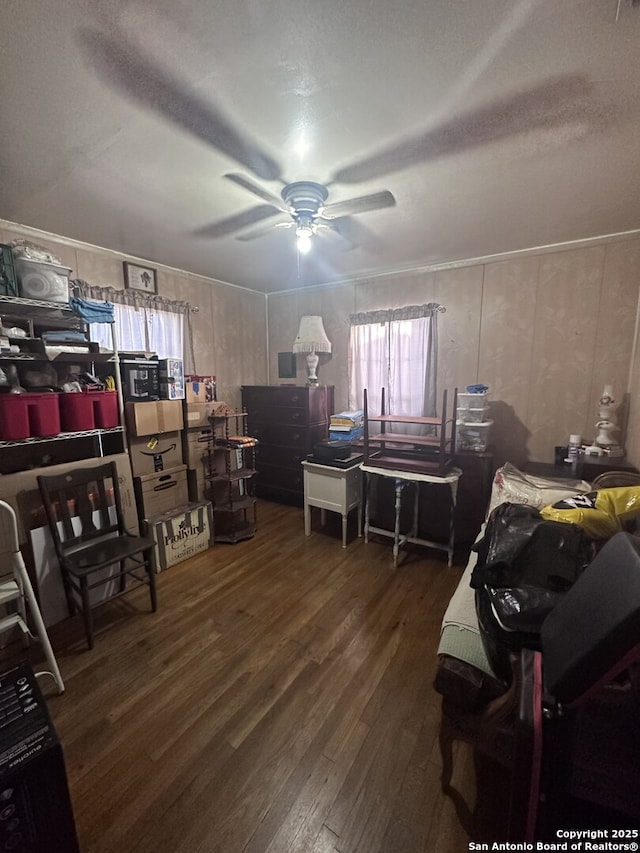 office with dark wood-type flooring and ceiling fan