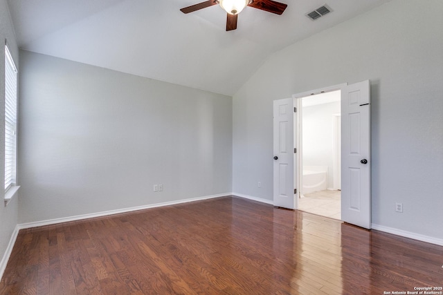 spare room with hardwood / wood-style flooring, lofted ceiling, and ceiling fan