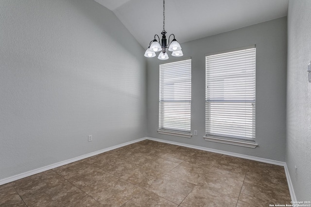 unfurnished room with lofted ceiling, tile patterned floors, and an inviting chandelier