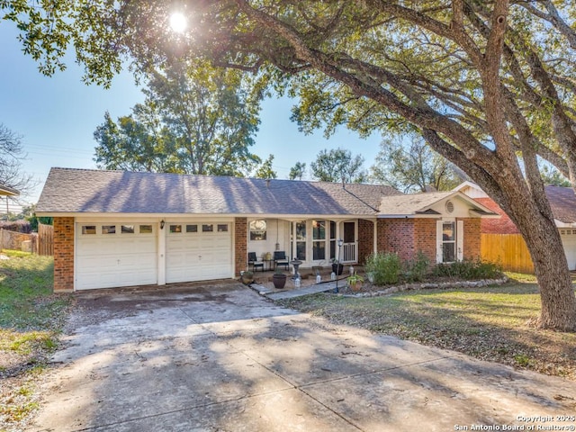 ranch-style home with a garage and a front yard