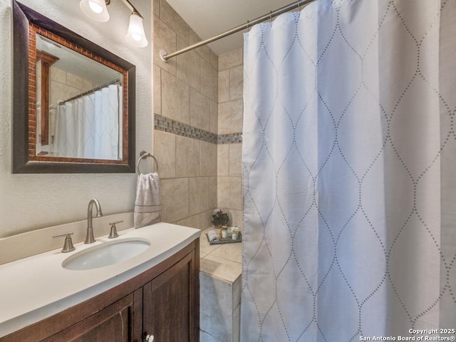 bathroom with vanity and a shower with shower curtain