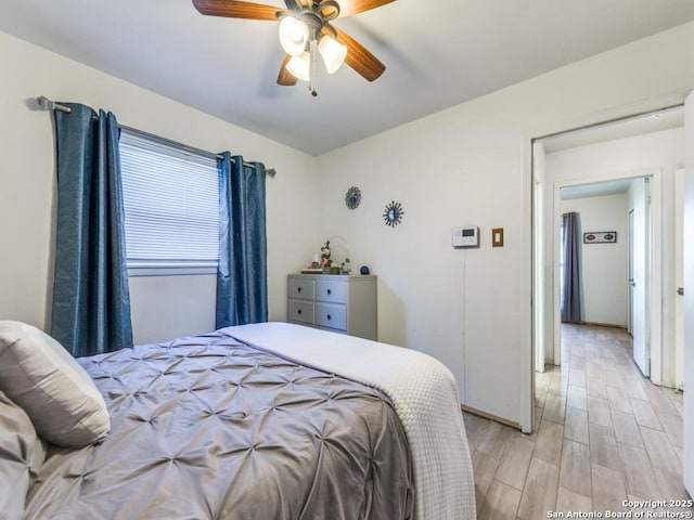 bedroom featuring ceiling fan and light hardwood / wood-style floors