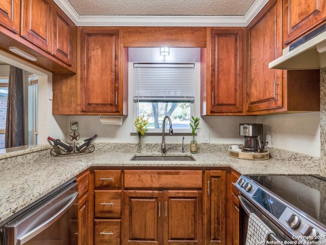 kitchen featuring light stone countertops, appliances with stainless steel finishes, sink, and a textured ceiling