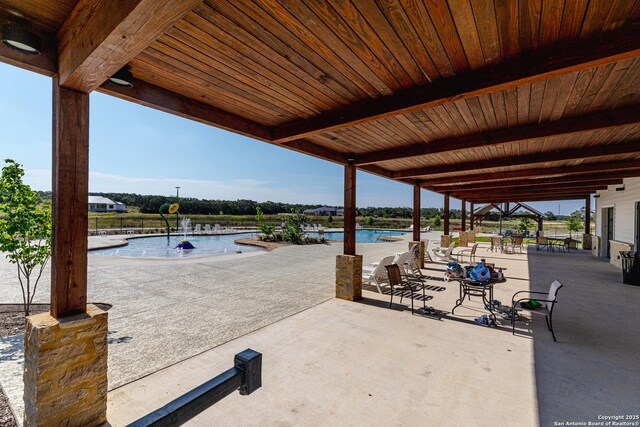 736 Johanna Ridge Rd, Bulverde, TX 78163 - view of patio featuring a water view and a community pool
