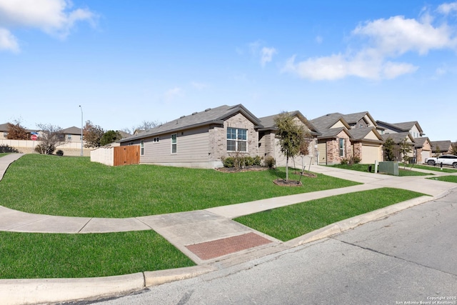 view of front facade featuring a garage and a front yard