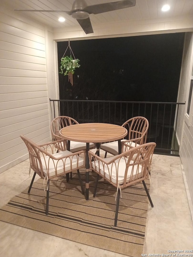 dining area featuring wooden walls