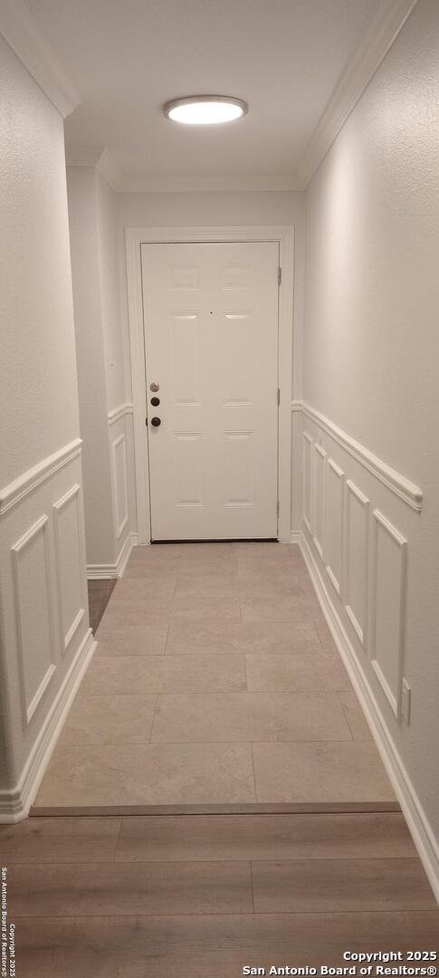 corridor with crown molding