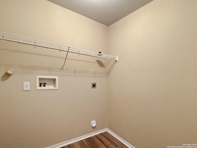 clothes washing area with hookup for an electric dryer, hookup for a gas dryer, hookup for a washing machine, and hardwood / wood-style floors