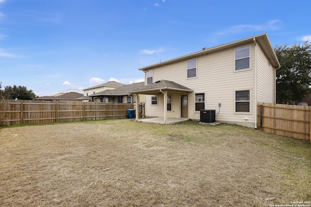 back of house with a patio area and central air condition unit