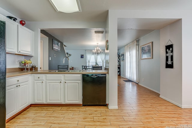 kitchen featuring white cabinetry, black dishwasher, sink, a chandelier, and hanging light fixtures