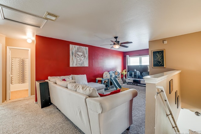 carpeted living room featuring ceiling fan